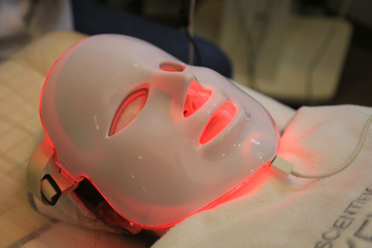 services-01 Close-up of an LED light mask used in modern skincare treatments.